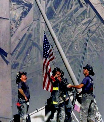 A sign of hope: Firemen raise flag at Ground Zero