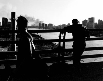 Two men view the dust cloud from a distance