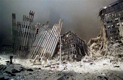Gound Zero: Remaining sections of the World Trade Center stand in the thick dust