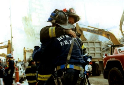 Heroes Embrace: Two hero firefighters offer each other encouragement and support